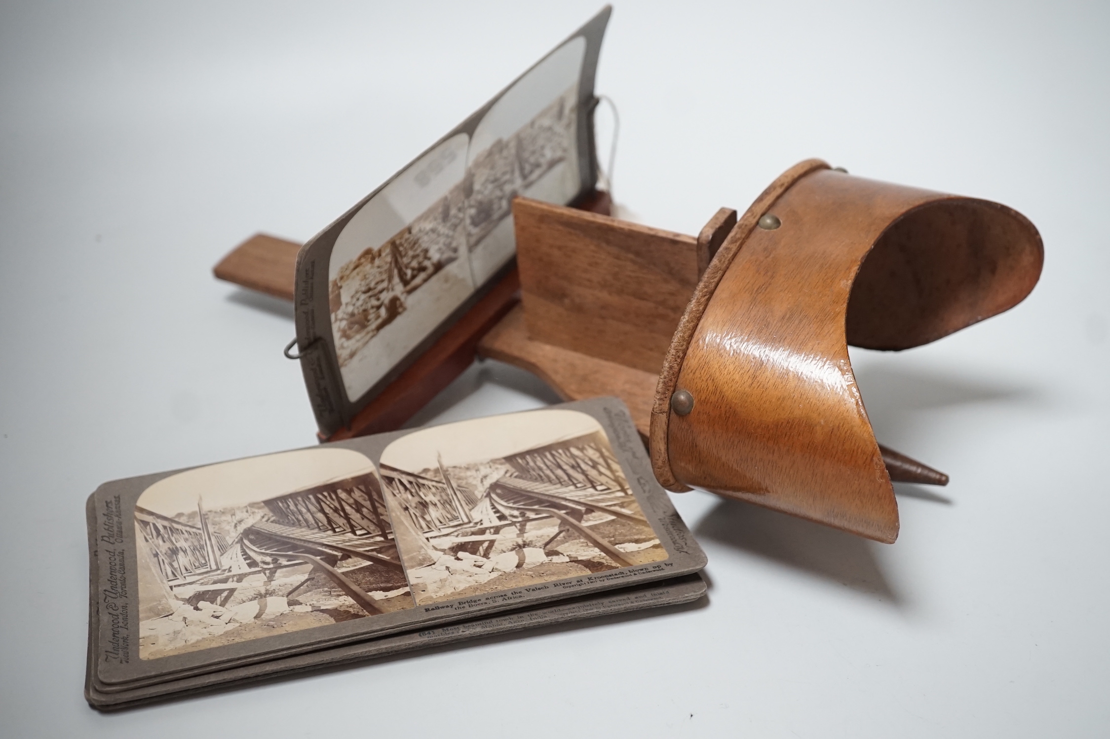 A stereoscopic viewer and assorted monochrome cards, South Africa and India